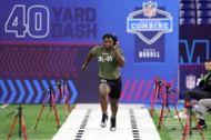 Keeanu Benton of Wisconsin participates in the 40-yard dash during the NFL Combine